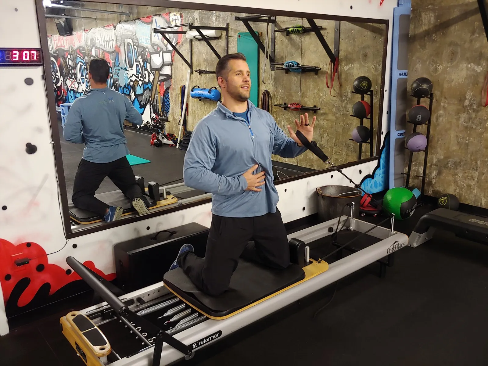 Jamie Atlas, personal trainer, on the reformer at his downtown Denver studio, 1800 Glenarm Place