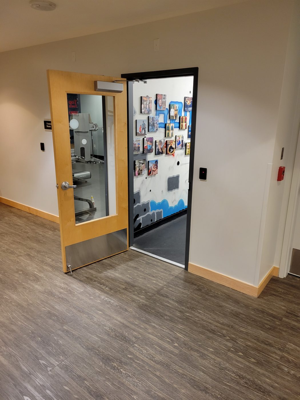 The studio entrance, with the wall of client photos visible through the open door